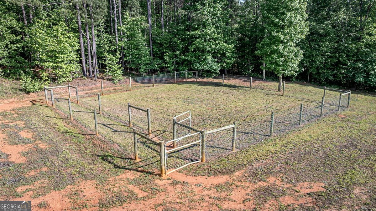 3093 Surry Ridge Drive Watkinsville, GA 30677 - Photo 37 of 41 a view of a backyard with wooden fence