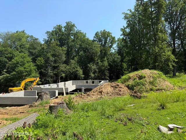 a view of backyard with swimming pool
