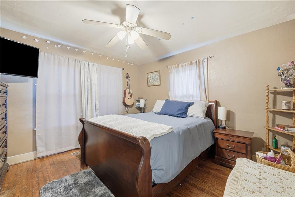 2108 Maple Avenue Southwest Rome, GA 30161 - Photo 11 of 19 a spacious bedroom with a bed and a flat screen tv
