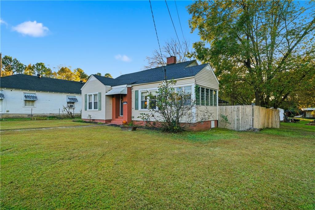 2108 Maple Avenue Southwest Rome, GA 30161 - Photo 17 of 19 a front view of a house with garden