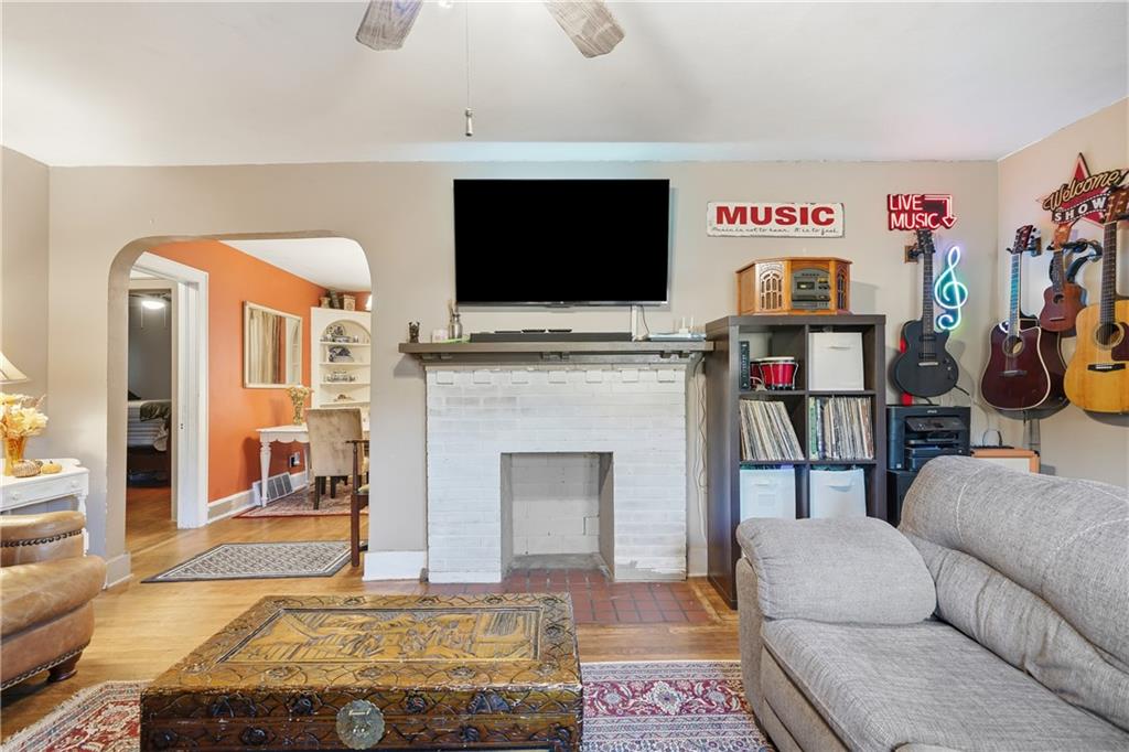 2108 Maple Avenue Southwest Rome, GA 30161 - Photo 2 of 19 a living room with furniture a flat screen tv and a fireplace