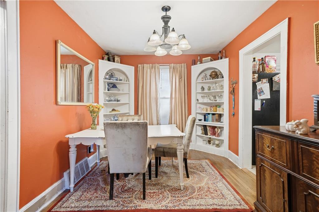 2108 Maple Avenue Southwest Rome, GA 30161 - Photo 6 of 19 a view of a dining room with furniture window and wooden floor