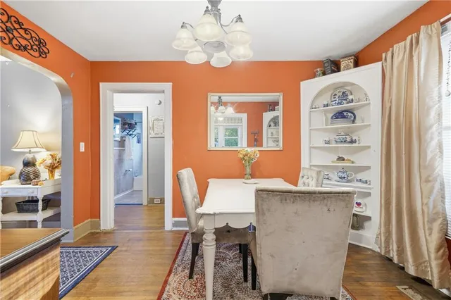 a room with cabinets a island and appliances