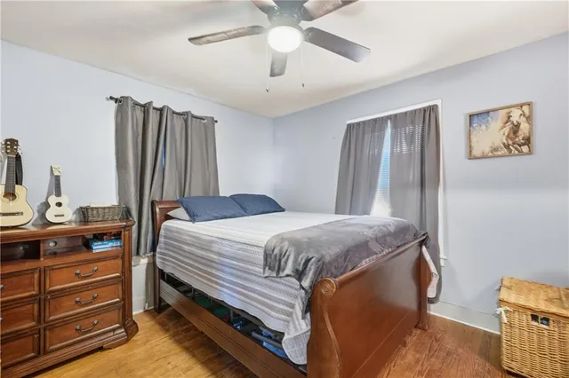 a bedroom with a bed and a dresser in it