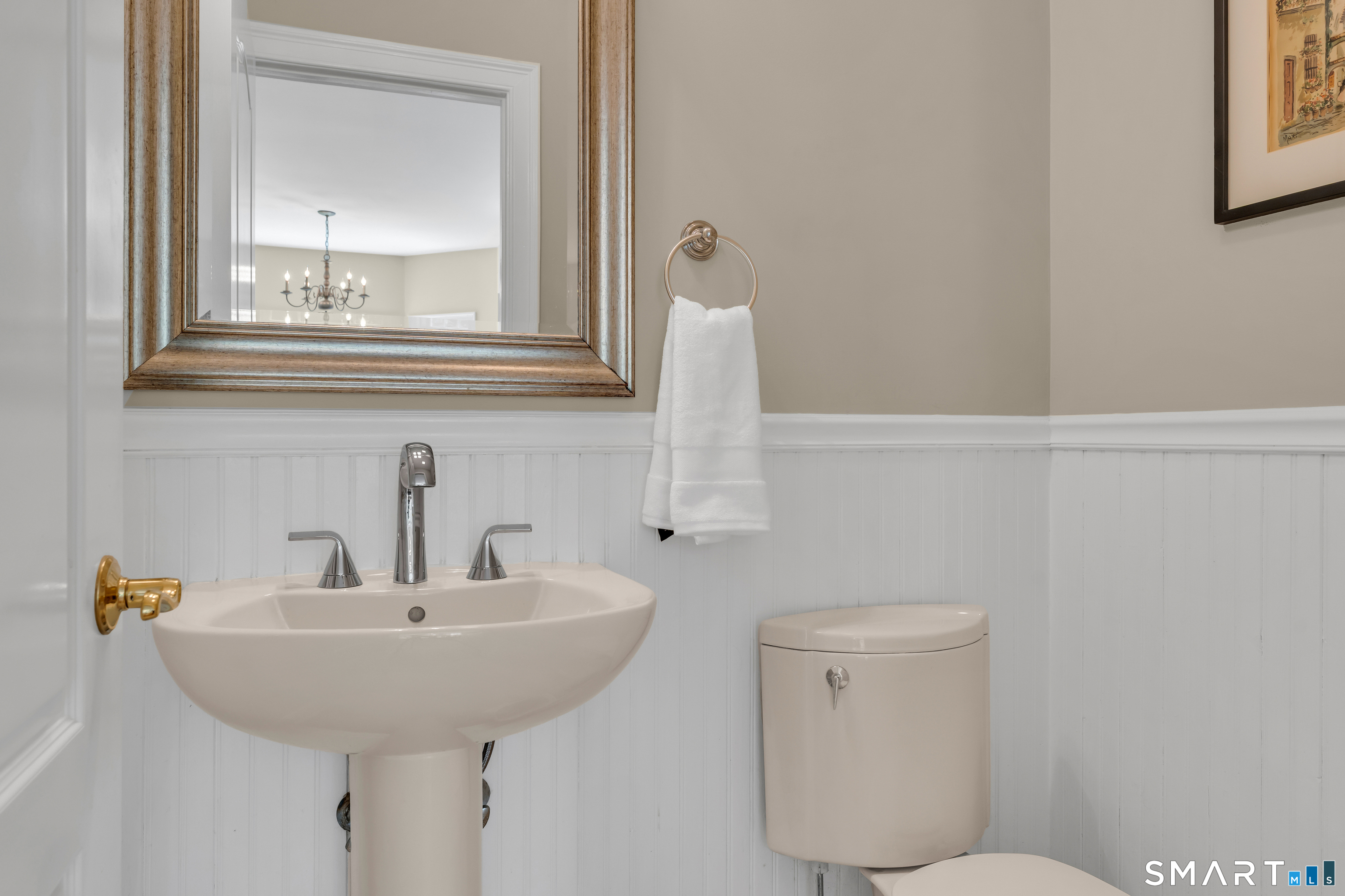 474 State Street Guilford, CT 06437 - Photo 19 of 40 a bathroom with a sink and a mirror