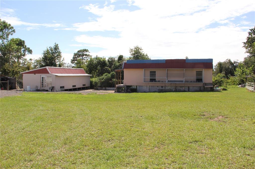 13127 Star Road Brooksville, FL 34613 - Photo 48 of 54 a house view with swimming pool in front of it