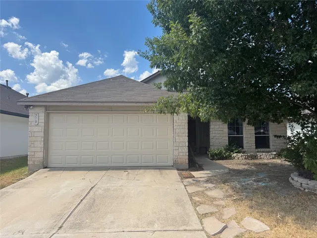a front view of a house with yard