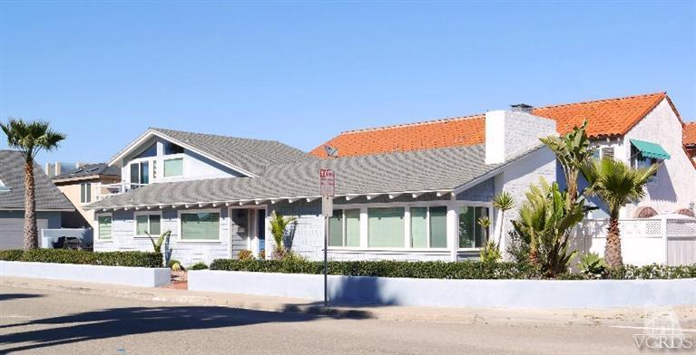 880 Mandalay Beach Road Oxnard, CA 93035 - Photo 1 of 21 front view of a house with a small yard