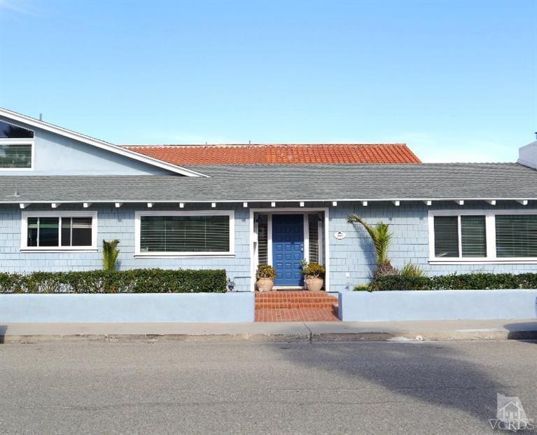 880 Mandalay Beach Road Oxnard, CA 93035 - Photo 3 of 21 a front view of a house with a garden