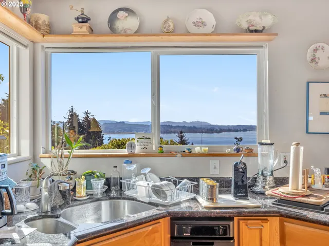 a kitchen with a sink and a window