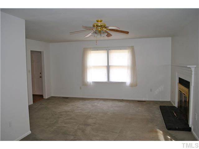 1326 Sedwick Road Durham, NC 27713 - Photo 3 of 19 a view of an empty room with a window