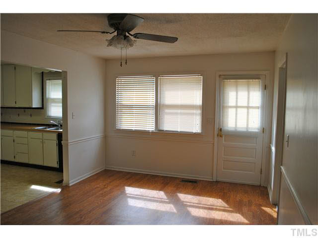 1326 Sedwick Road Durham, NC 27713 - Photo 5 of 19 a view of an empty room with a window