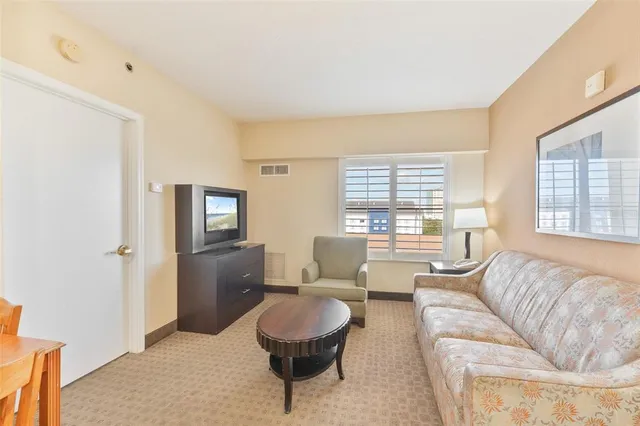 a kitchen with a sink a refrigerator a stove and cabinets