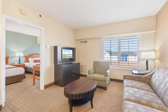 a bedroom with a bed and a dresser in it