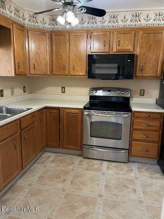 1 Pondview Drive, Unit C3 Pittsfield, MA 01201 - Photo 4 of 20 a kitchen with stainless steel appliances a stove and a sink