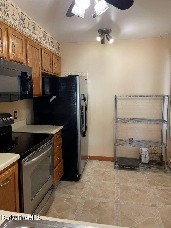 1 Pondview Drive, Unit C3 Pittsfield, MA 01201 - Photo 7 of 20 a kitchen with stainless steel appliances a refrigerator and cabinets