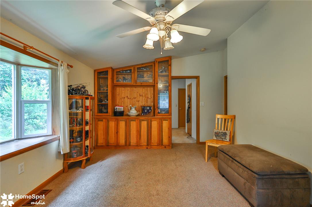 3795 Rhoades Road Kempton, PA 19529 - Photo 27 of 42 A cozy living space boasts a built-in display cabinet and ample natural light from the bay window.