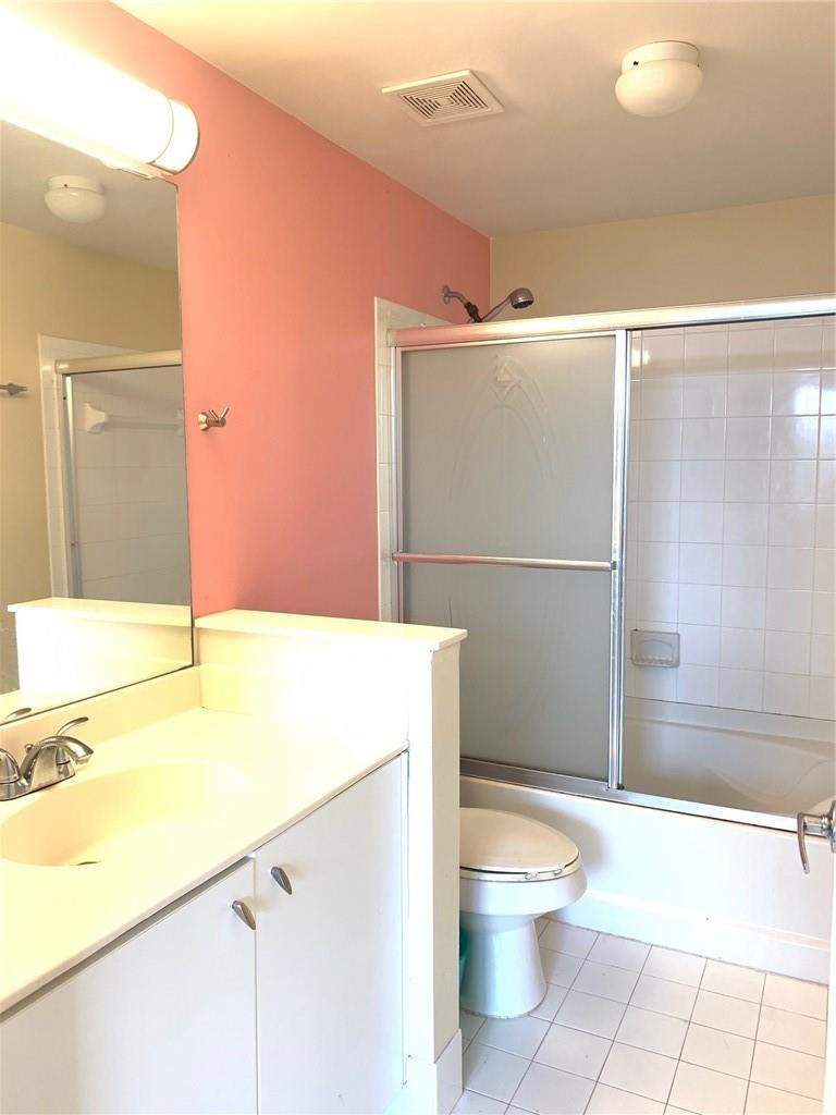 5980 West Sample Road, Unit 303 Coral Springs, FL 33067 - Photo 13 of 32 a bathroom with a granite countertop sink mirror vanity and toilet