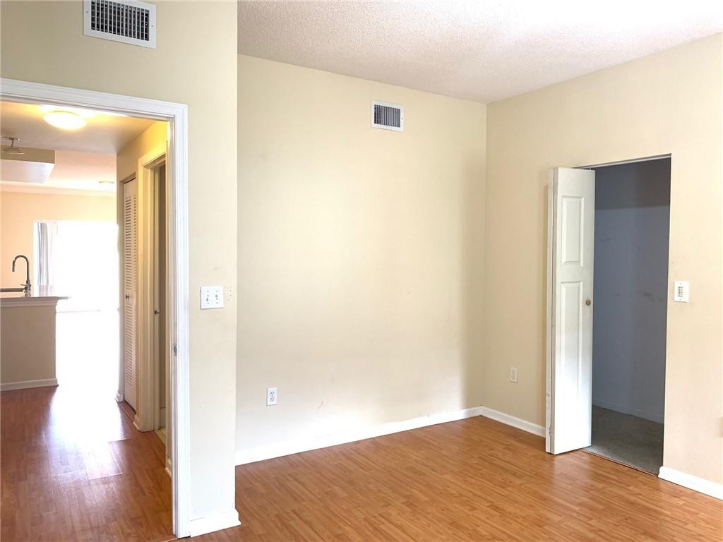 5980 West Sample Road, Unit 303 Coral Springs, FL 33067 - Photo 19 of 32 a view of a room with wooden floor