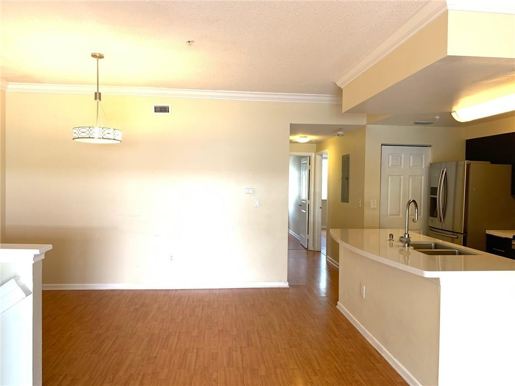 5980 West Sample Road, Unit 303 Coral Springs, FL 33067 - Photo 5 of 32 a bathroom with a sink a faucet a mirror and a shower
