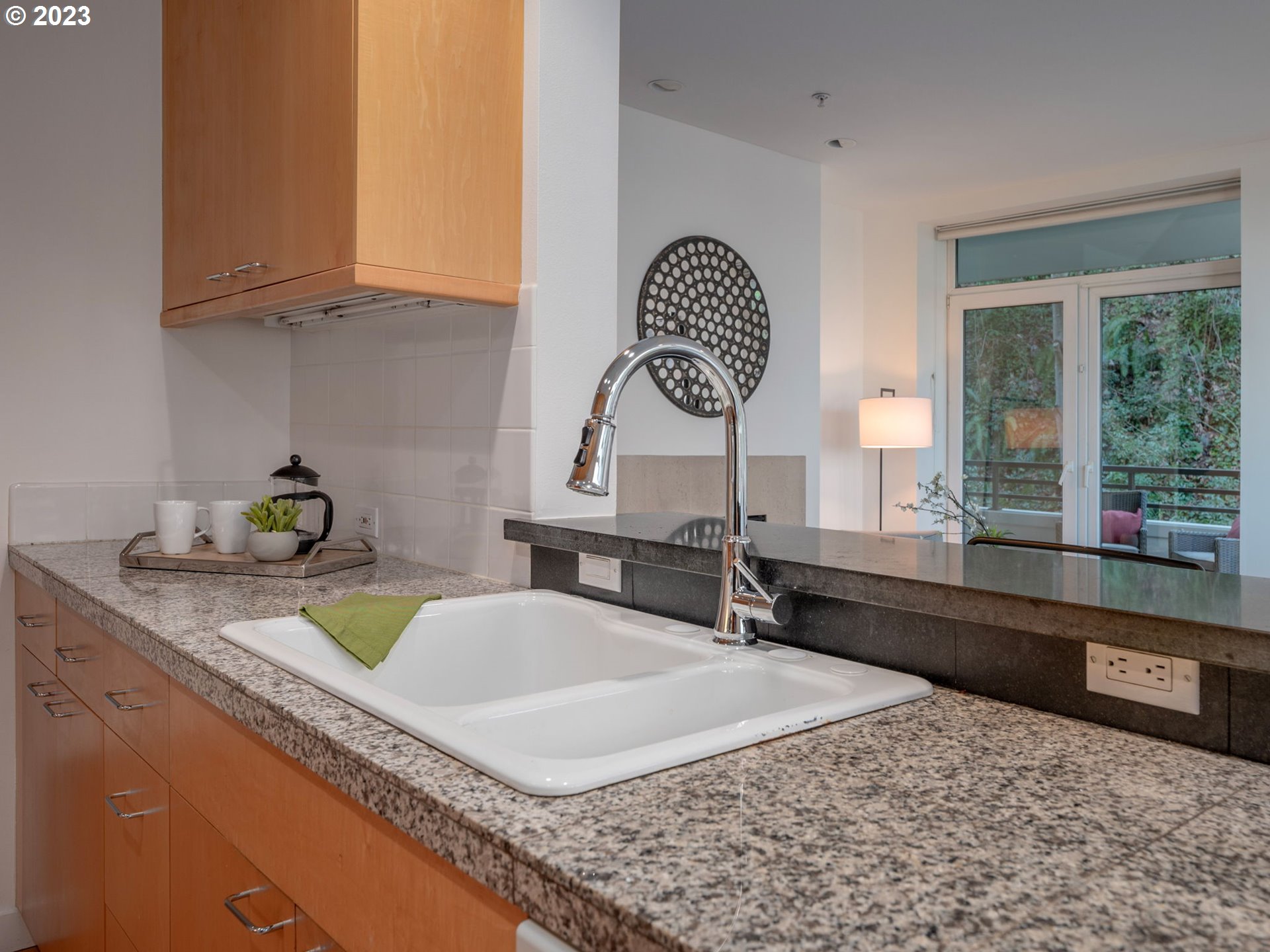 2445 Northwest Westover Road, Unit 314 Portland, OR 97210 - Photo 11 of 32 a kitchen with a sink and a stove top oven