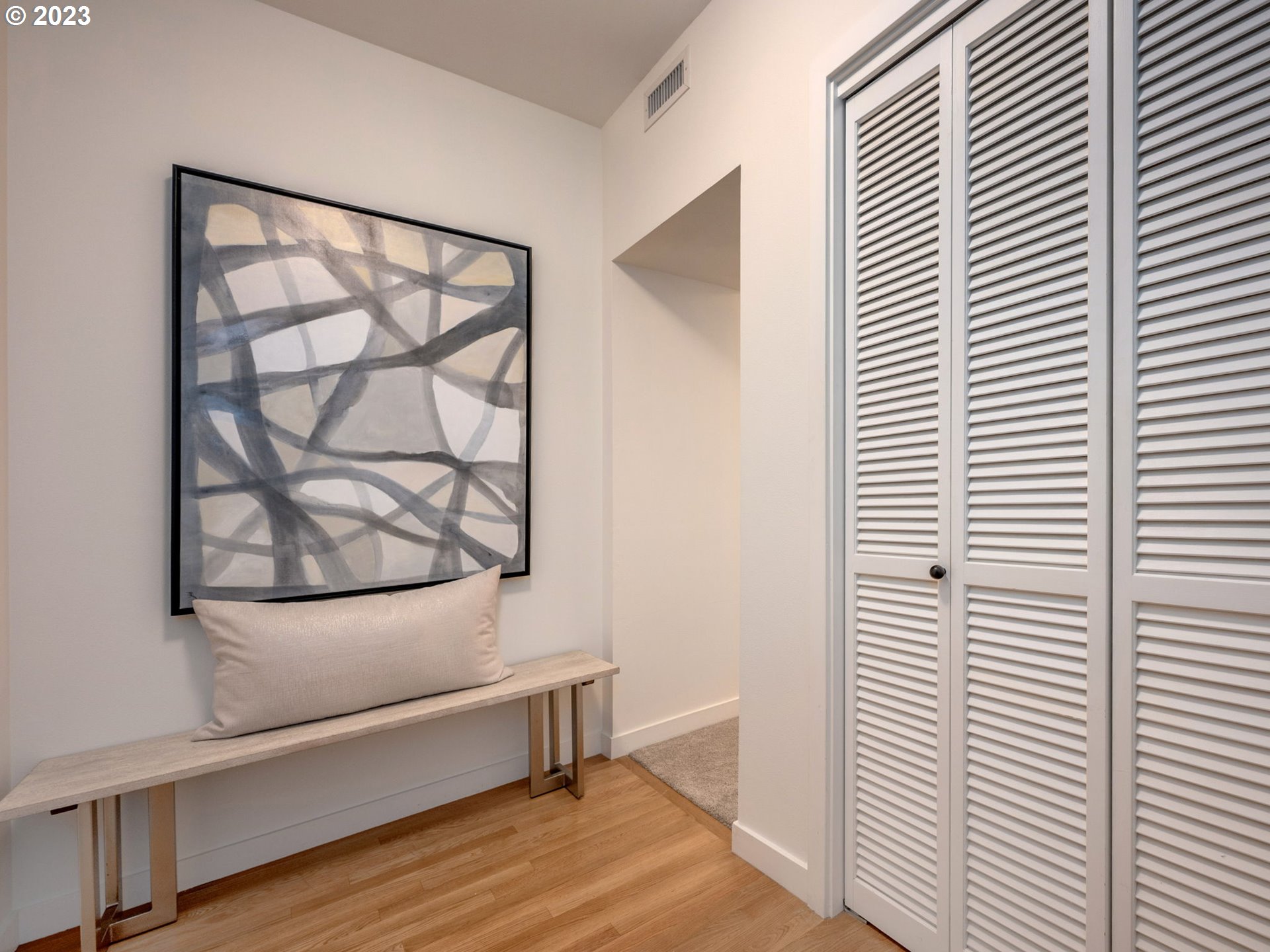 2445 Northwest Westover Road, Unit 314 Portland, OR 97210 - Photo 15 of 32 a view of a room with wooden floor and a window