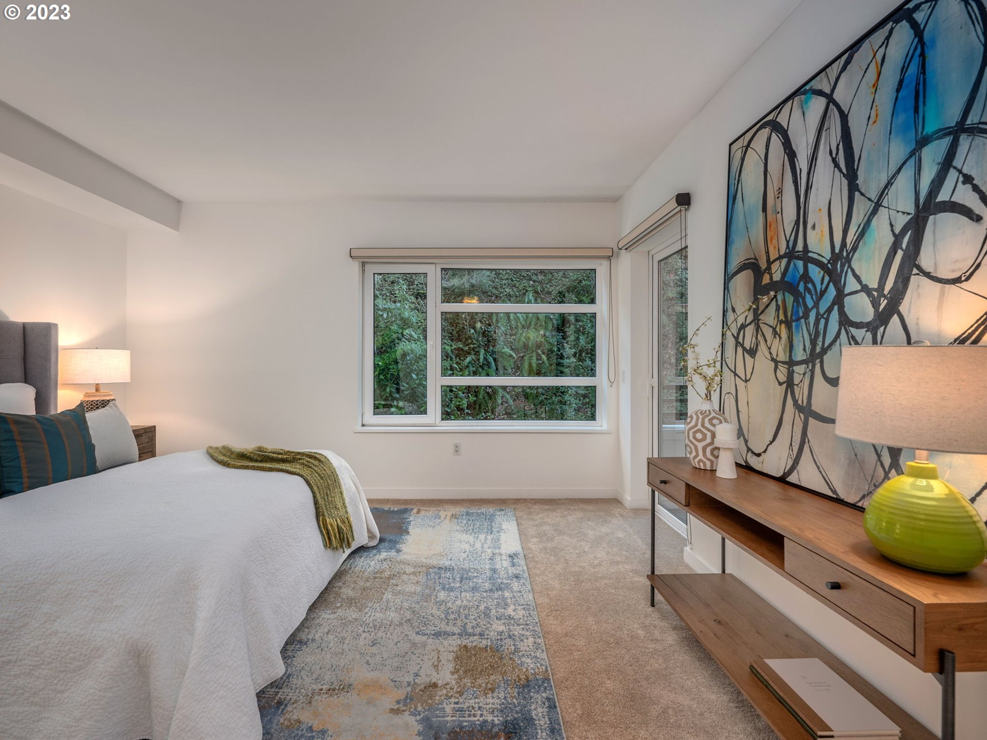 2445 Northwest Westover Road, Unit 314 Portland, OR 97210 - Photo 17 of 32 a bedroom with a bed and window