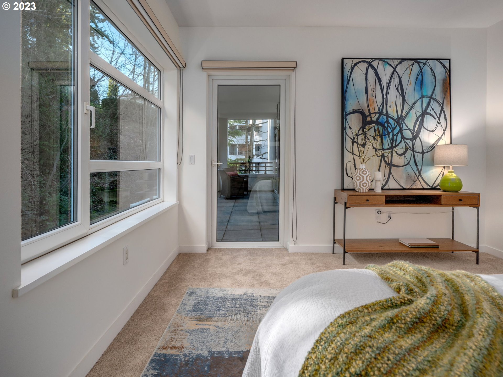 2445 Northwest Westover Road, Unit 314 Portland, OR 97210 - Photo 18 of 32 a bedroom with a bed and a window