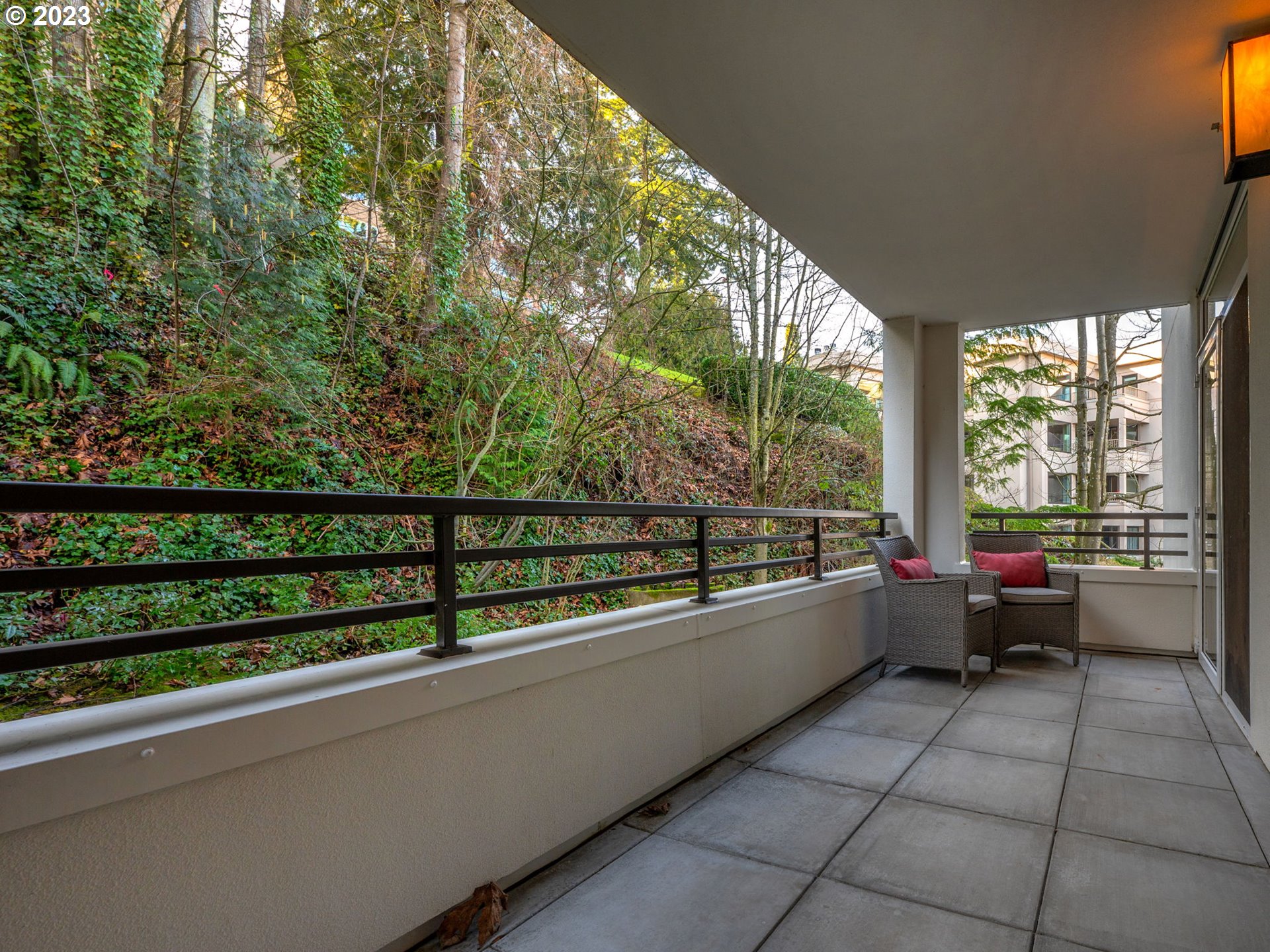 2445 Northwest Westover Road, Unit 314 Portland, OR 97210 - Photo 20 of 32 a view of two chairs in a balcony
