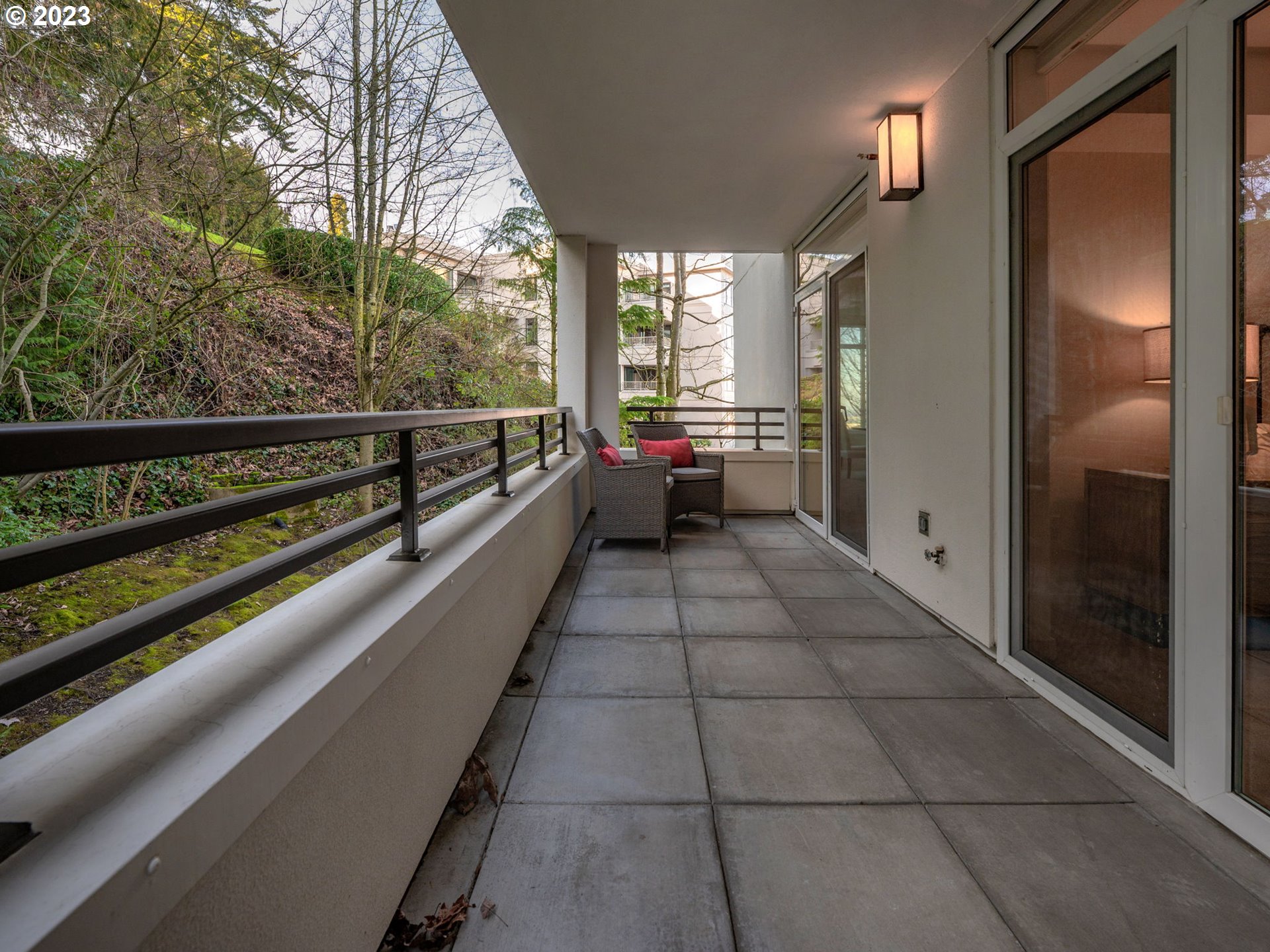 2445 Northwest Westover Road, Unit 314 Portland, OR 97210 - Photo 21 of 32 a view of a balcony with chairs