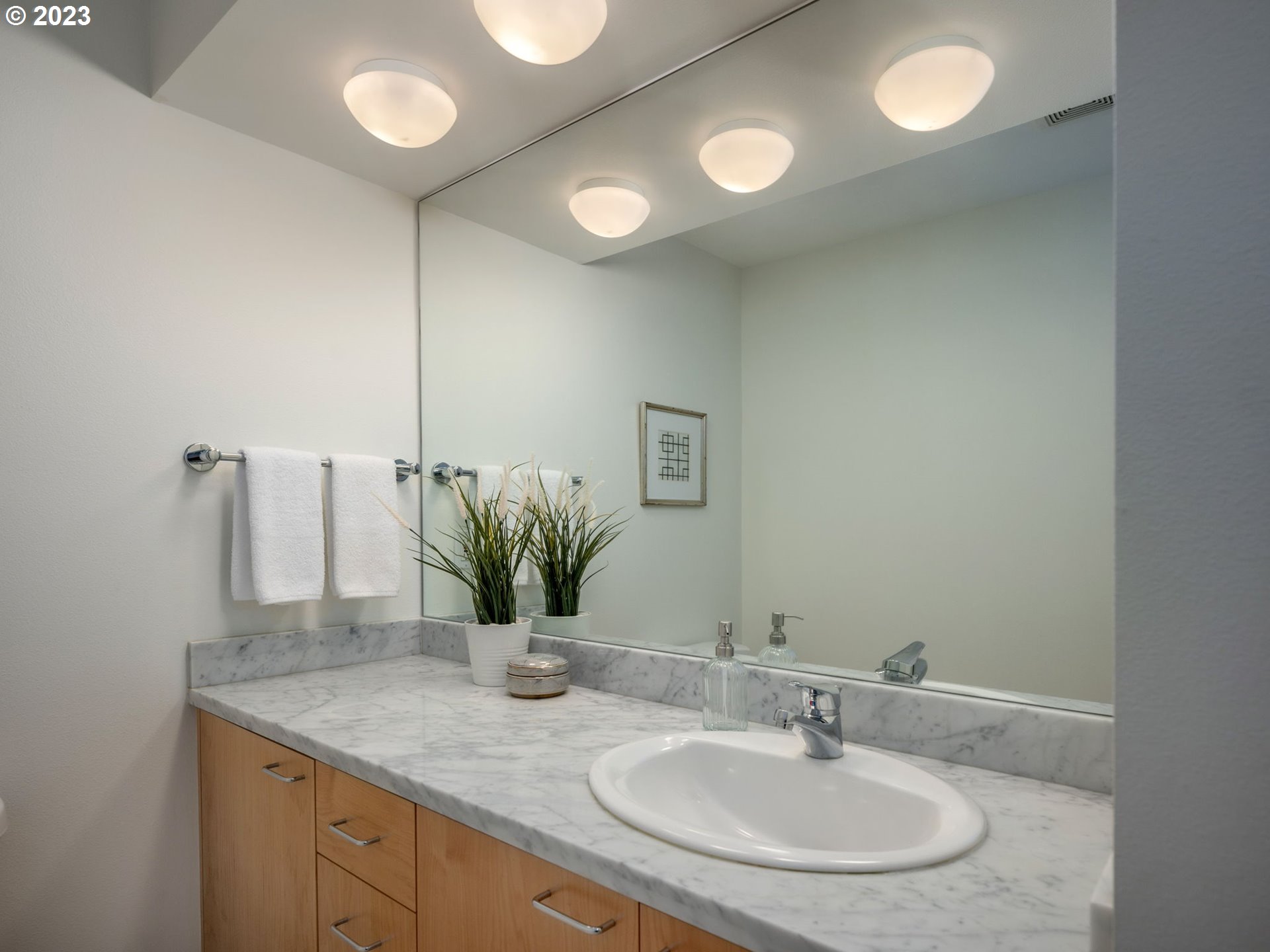 2445 Northwest Westover Road, Unit 314 Portland, OR 97210 - Photo 25 of 32 a bathroom with a sink and a mirror