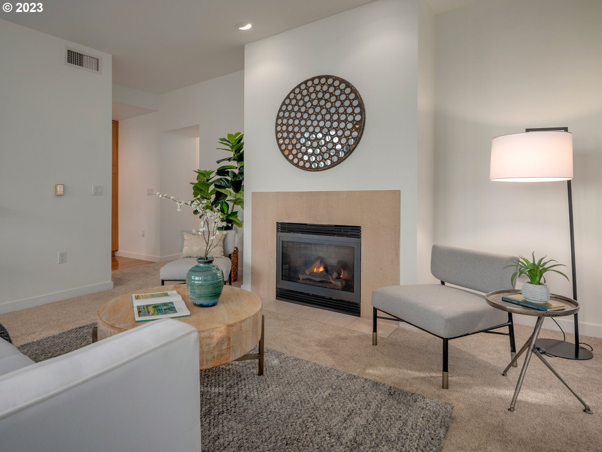 2445 Northwest Westover Road, Unit 314 Portland, OR 97210 - Photo 3 of 32 a living room with furniture and a fireplace