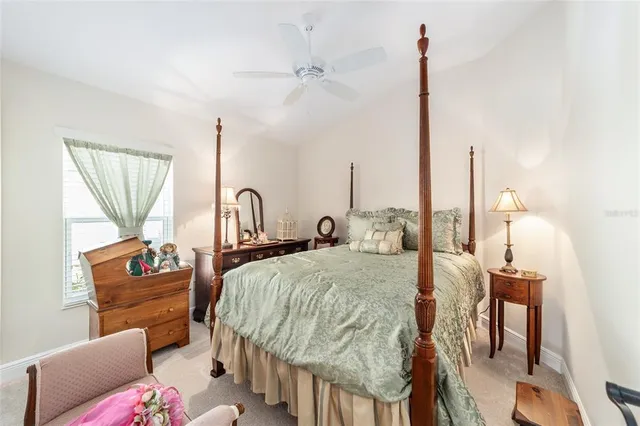 a bedroom with furniture and a wooden floor