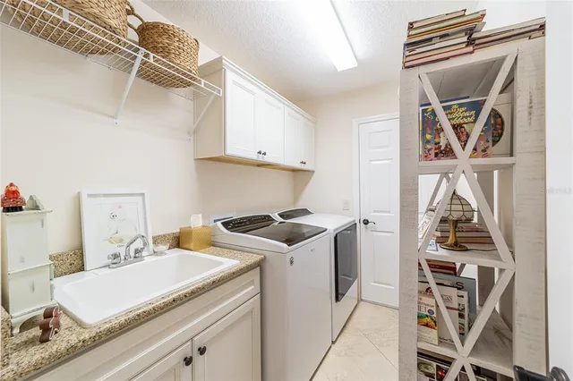 a kitchen with stainless steel appliances granite countertop a stove and a refrigerator
