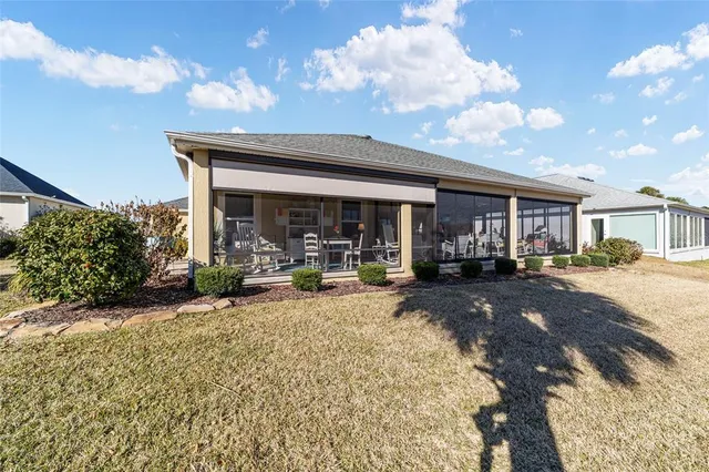 a view of a lake with houses in the background