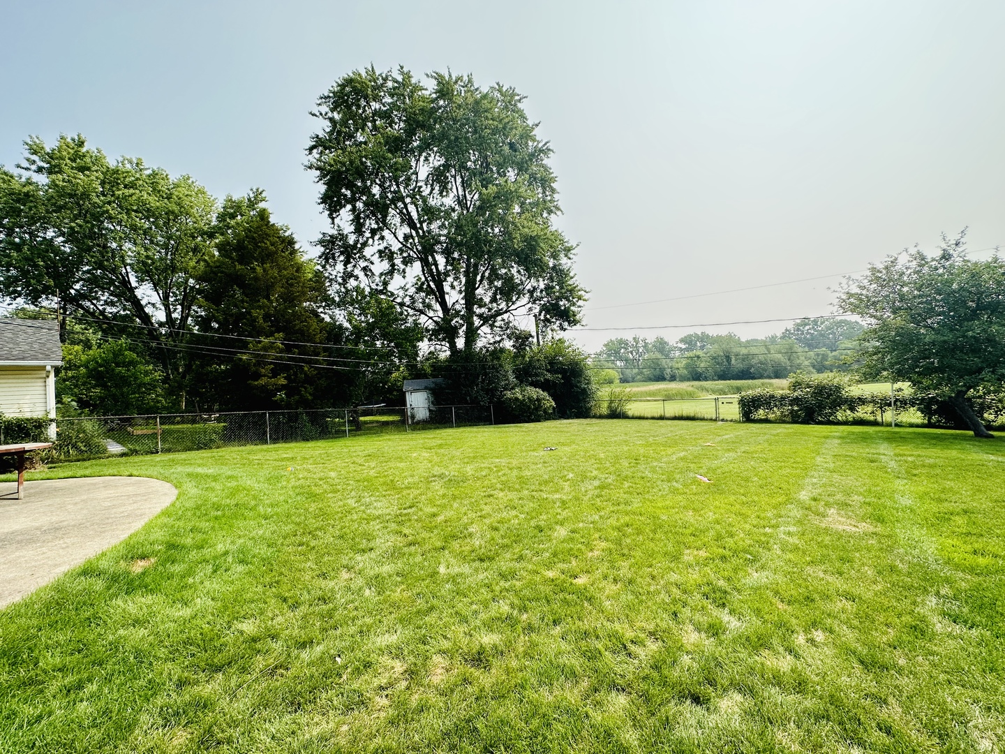 701 Parkside Circle Streamwood, IL 60107 - Photo 12 of 13 a view of a yard with a house