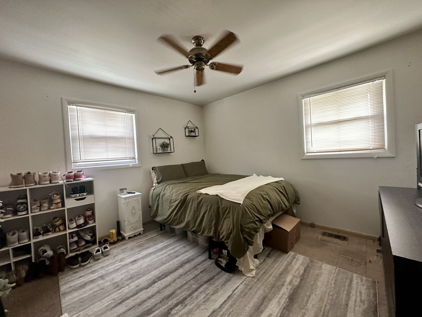 701 Parkside Circle Streamwood, IL 60107 - Photo 5 of 13 a bedroom with a bed and a window