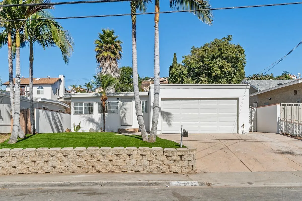 9732 St George Street Spring Valley, CA 91977 - Photo 26 of 26 front view of a house with a yard and a garage