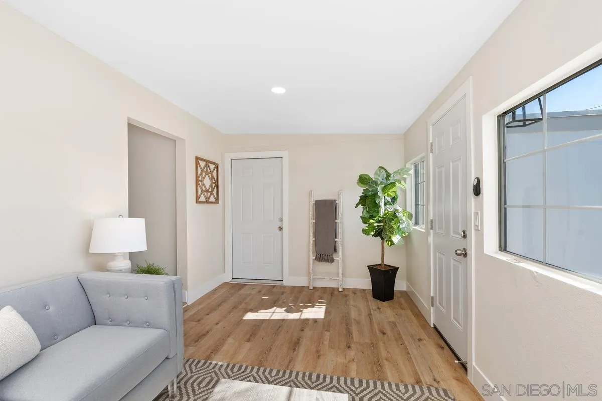 9732 St George Street Spring Valley, CA 91977 - Photo 5 of 26 a bedroom with a bed and a couch