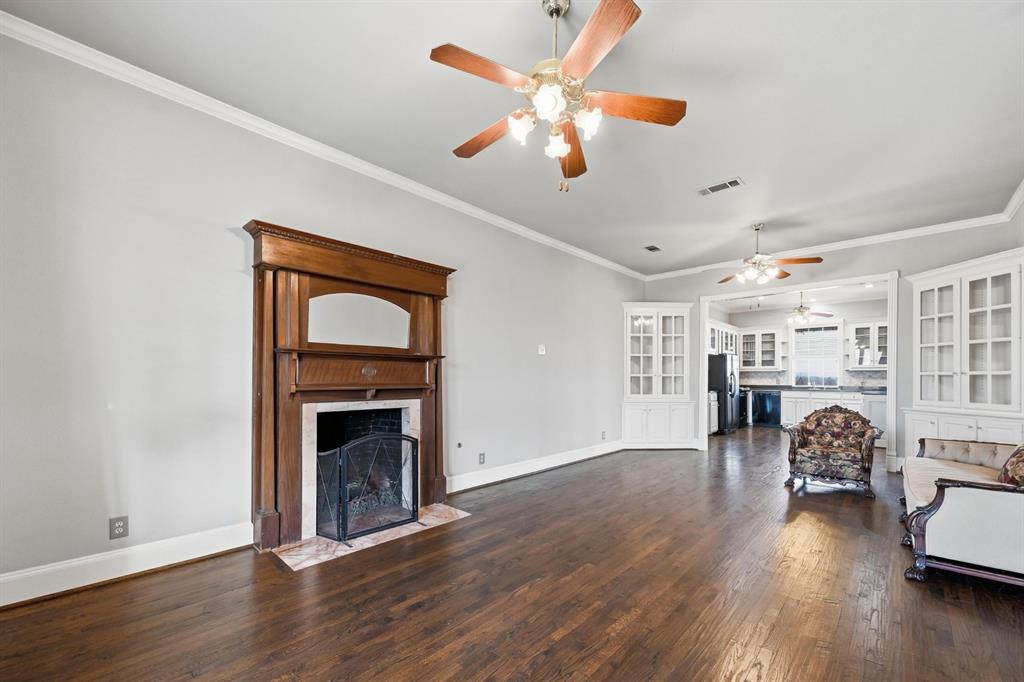 707 Cullins Road Rockwall, TX 75032 - Photo 13 of 40 a living room with furniture fireplace and wooden floor