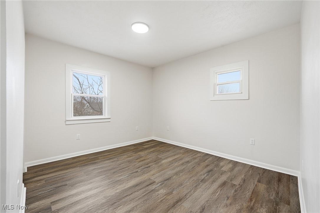 7911 Snow Road Parma, OH 44129 - Photo 24 of 44 Spare room featuring wood finished floors and plenty of natural light