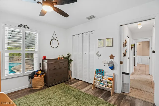 a bedroom with furniture and a window