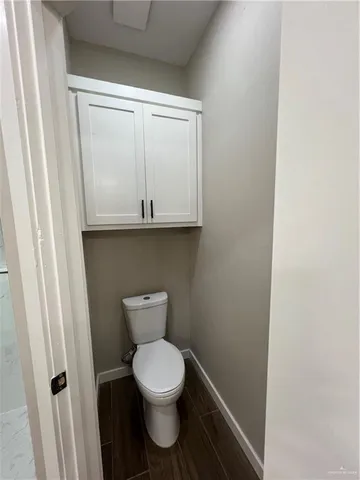 a bathroom with a toilet and a sink
