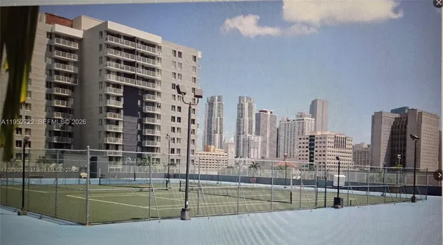 front view of a building with a garden