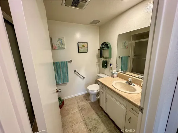 a bathroom with a glass door shower