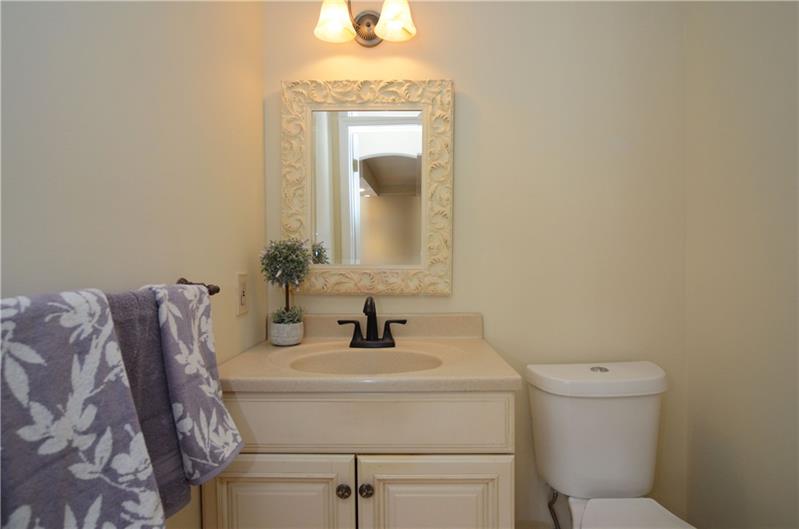 4 Wellington Court McKees Rocks, PA 15136 - Photo 12 of 24 COMPLETELY UPDATED HALF BATH WITH HARDWOOD FLOORS, VANITY AND FIXTURES