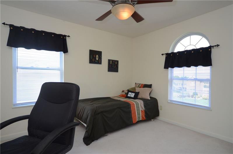 4 Wellington Court McKees Rocks, PA 15136 - Photo 18 of 24 BEDROOM WIH ARCHED WINDOW, NEUTRAL DECOR, AND CEILING FAN