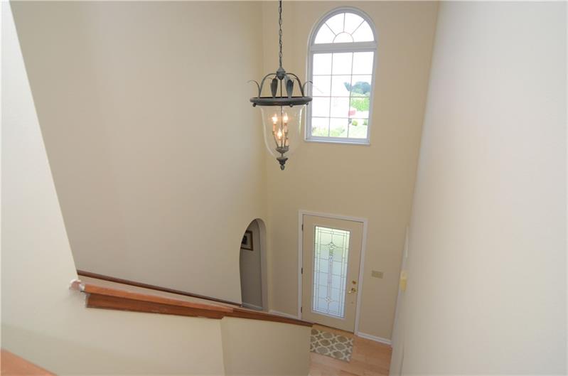 4 Wellington Court McKees Rocks, PA 15136 - Photo 3 of 24 OPEN STAIRCASE TO THE SECOND FLOOR, UPDATED ATTRACTIVE CHANDELIER