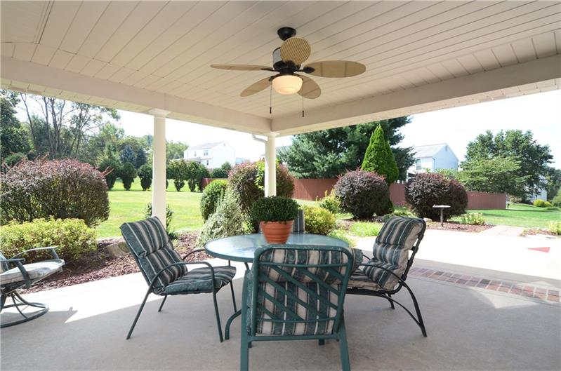 4 Wellington Court McKees Rocks, PA 15136 - Photo 23 of 24 COVERED PATIO FOR SUMMER ENTERTAINING IN THE LUSHLY LANDSCAPED LEVEL BACK YARD