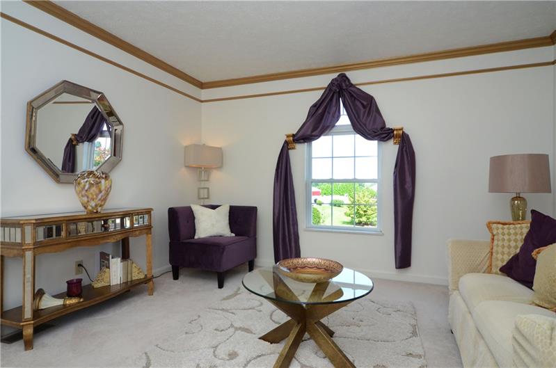 4 Wellington Court McKees Rocks, PA 15136 - Photo 4 of 24 FORMAL LIVING ROOM WITH CROWN MOLDINGS, NEUTRAL CARPET AND DECOR